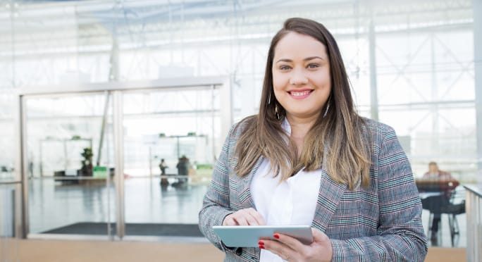 woman with a tablet in a business centre